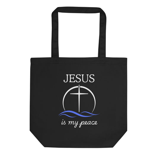 Black cotton tote bag with “JESUS” above a cross-in-circle graphic with blue waves and the phrase “is my peace” in white script.