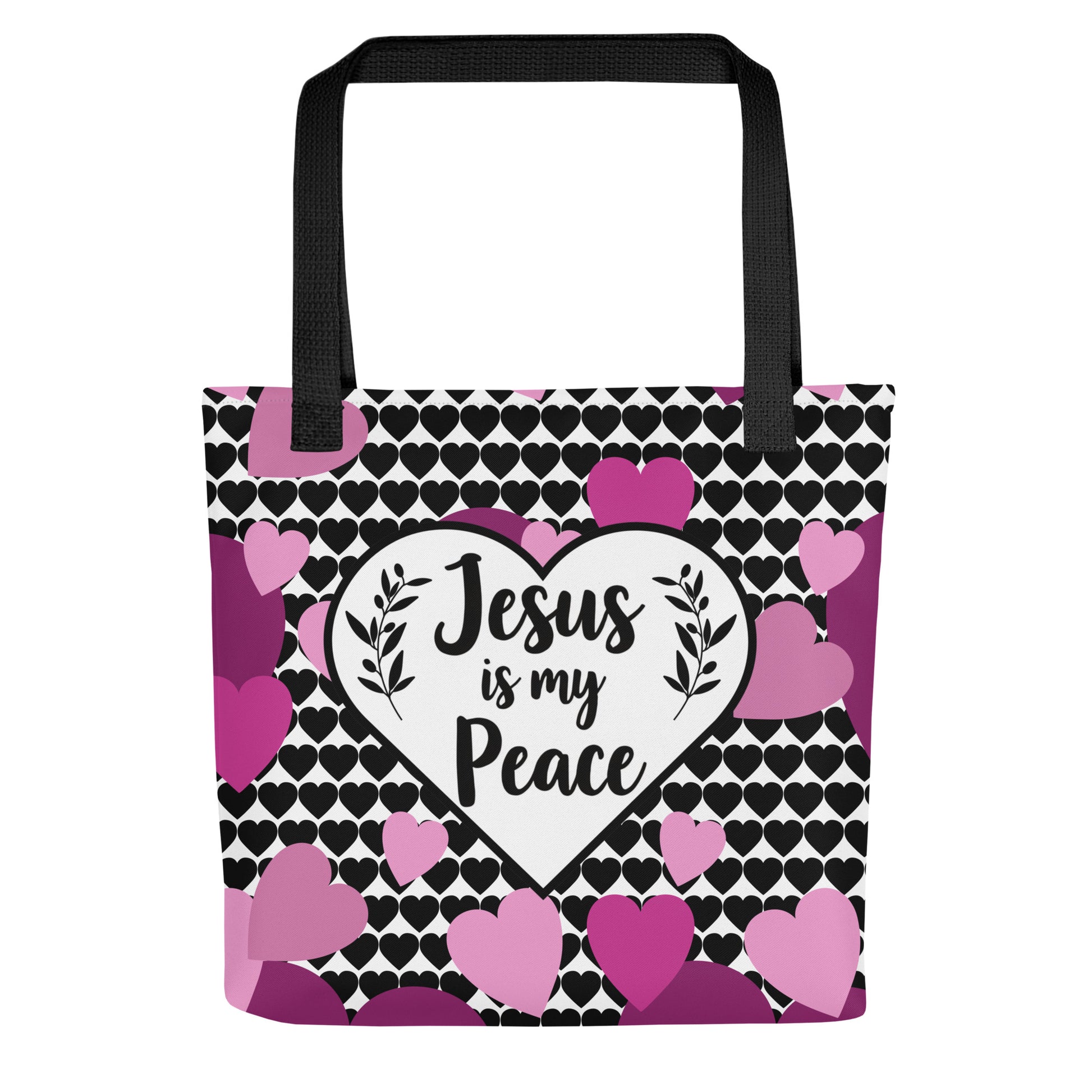 Front view of a tote bag with black straps, a black heart-pattern background, and a white heart design that reads “Jesus is my Peace,” surrounded by pink and purple hearts.