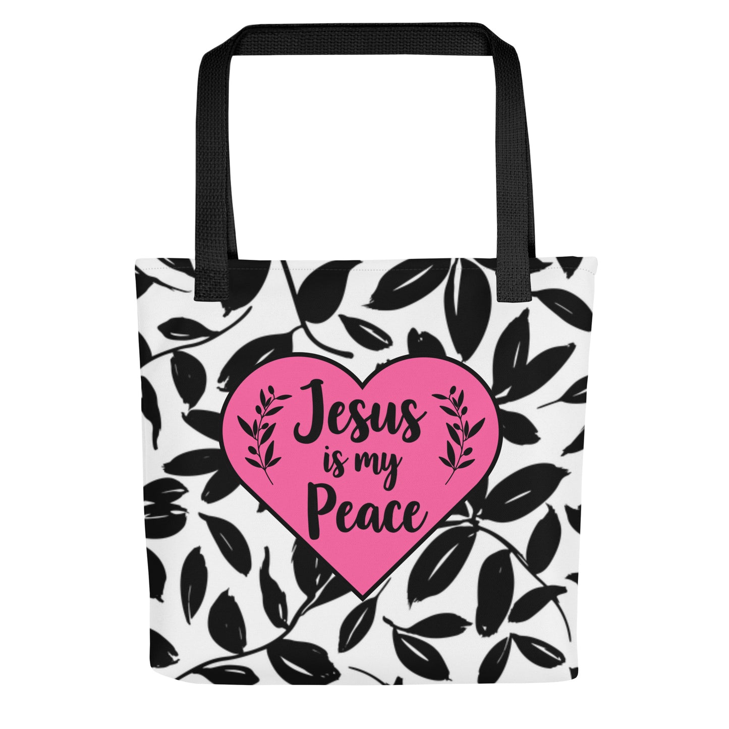 Front view of black-handle tote bag with black leaf pattern and pink heart graphic reading “Jesus is my Peace.”