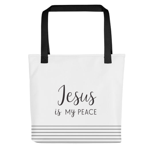 White tote bag with black handles featuring “Jesus is my peace” in dark gray text and gray stripes along the bottom.