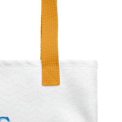 Close-up of the tote’s textured fabric and yellow handle stitching over the light blue wave print.