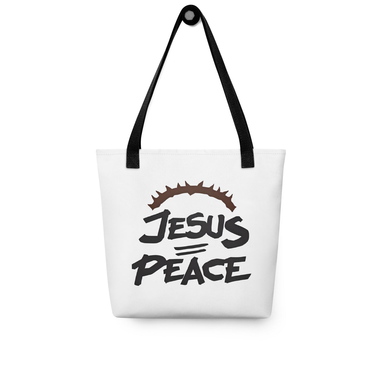 White tote bag with black handles hanging on a hook, displaying the “JESUS PEACE” graphic with crown of thorns.