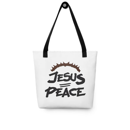 White tote bag with black handles hanging on a hook, displaying the “JESUS PEACE” graphic with crown of thorns.