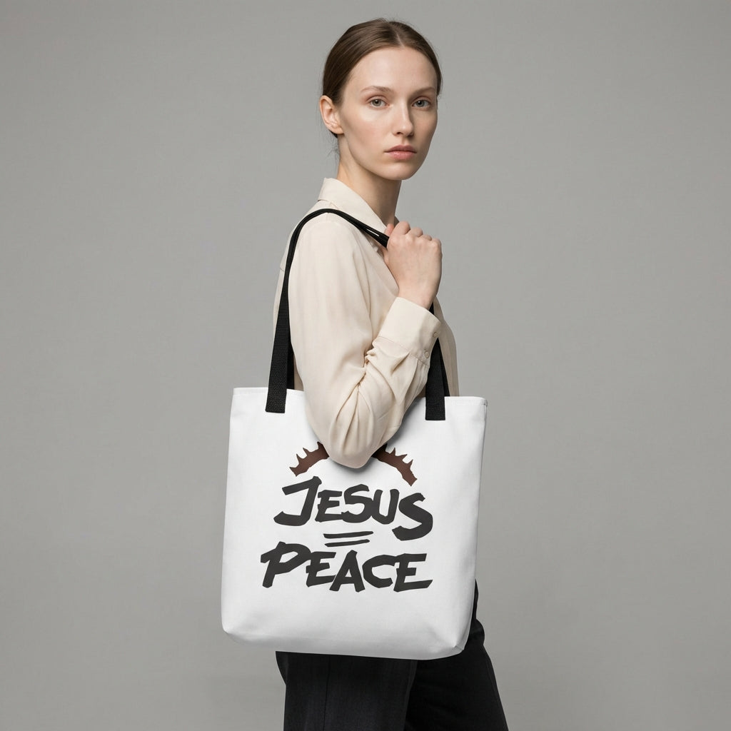 Model wearing a white tote with black handles featuring the “JESUS PEACE” design and crown of thorns graphic.