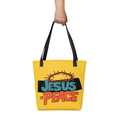Hand holding yellow tote bag with black handles and “JESUS = PEACE” graphic with a crown of thorns.