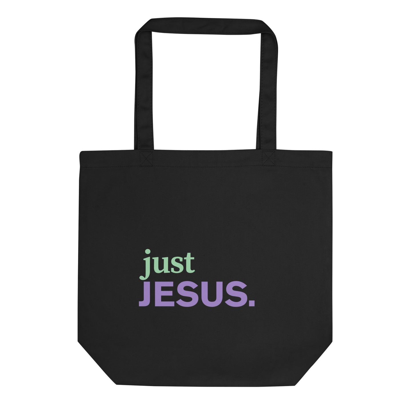 Black cotton tote bag with “just JESUS.” printed on the front in green and purple text.