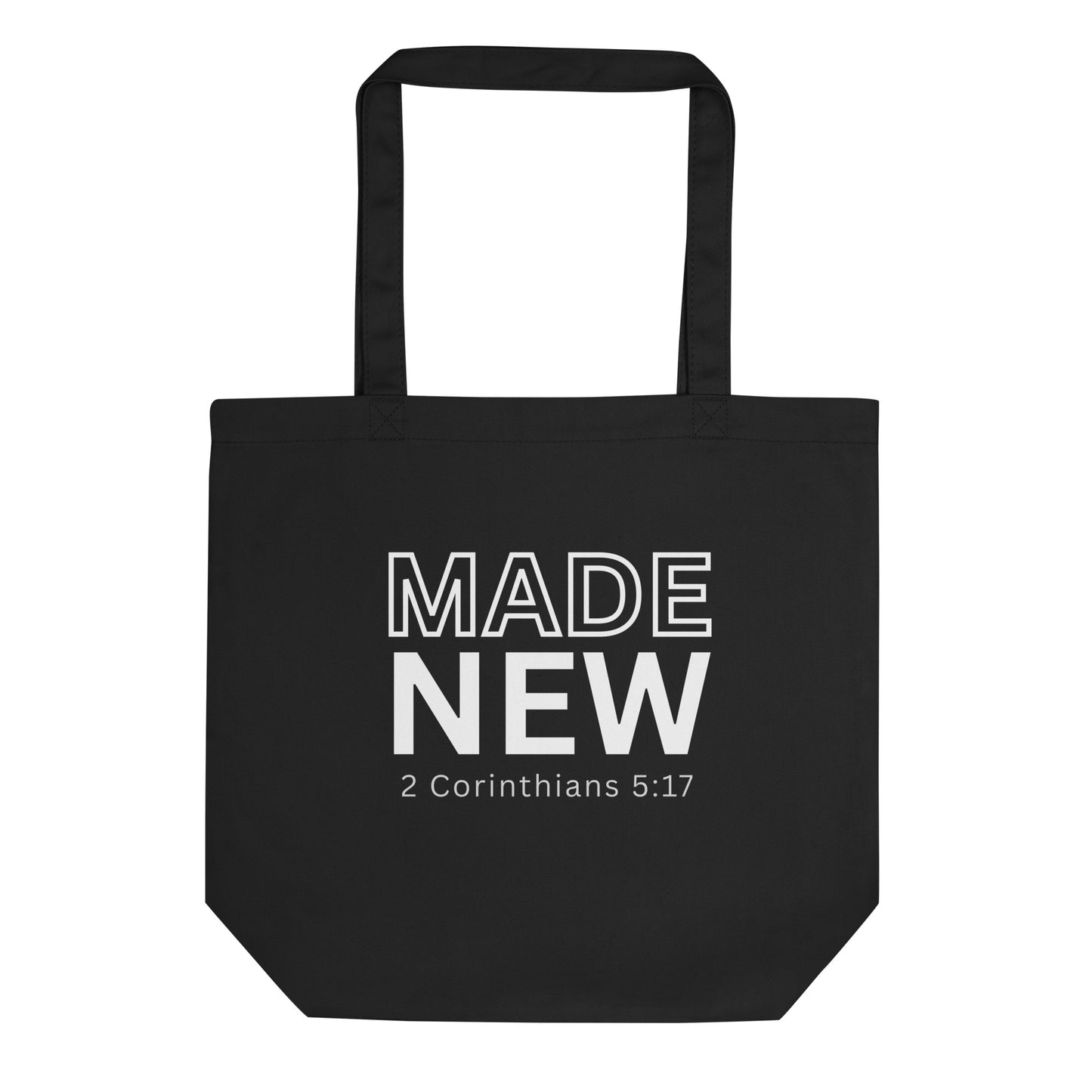 Black cotton tote bag with “MADE NEW” in bold white text and “2 Corinthians 5:17” underneath.