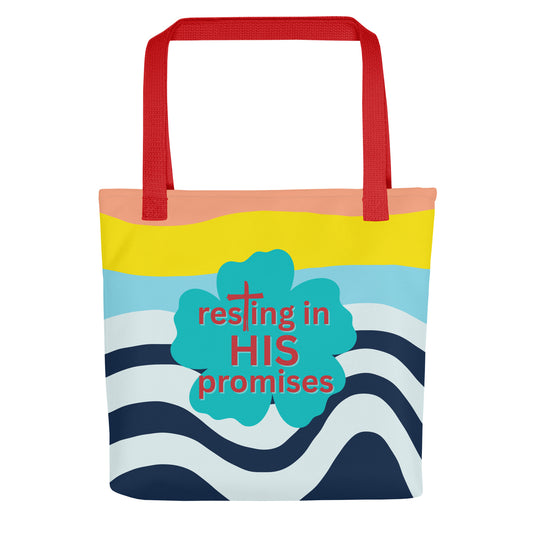 Front view of tote bag with red straps, colorful wave pattern, and teal clover graphic reading “resting in HIS promises.