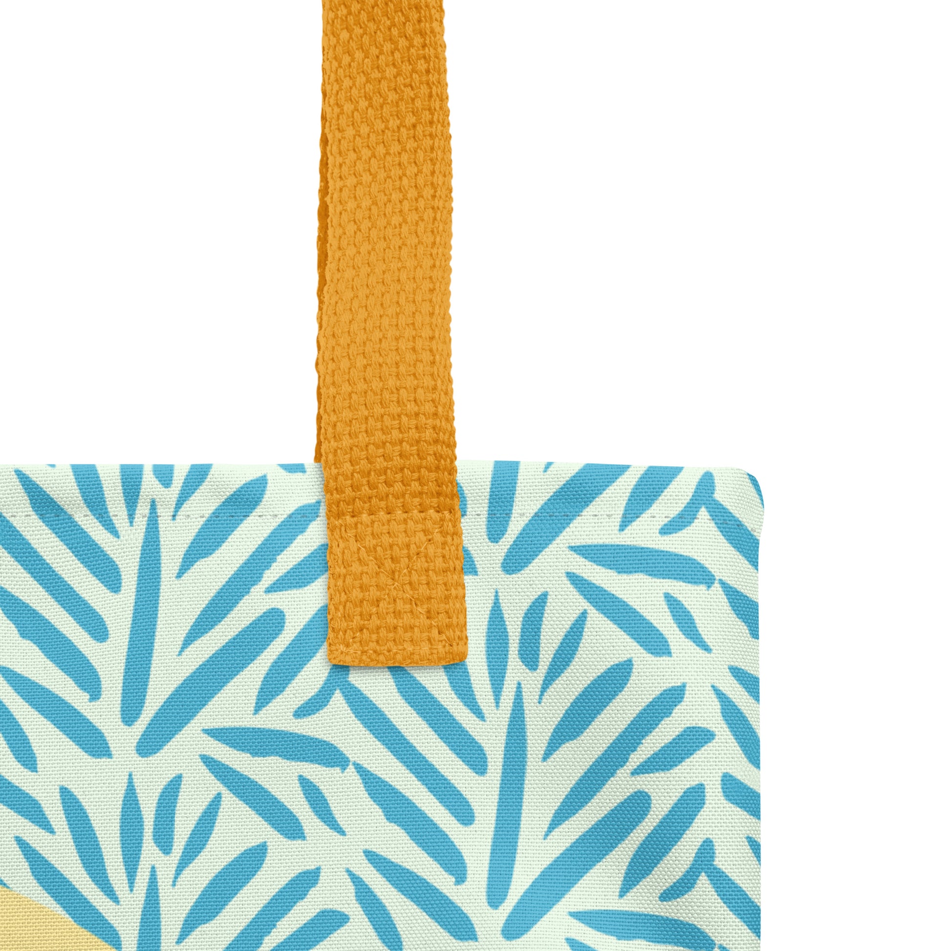 Close-up detail of the blue leaf pattern and yellow strap on the “Resting in His Promises” Matthew 11:28–30 Christian tote bag.