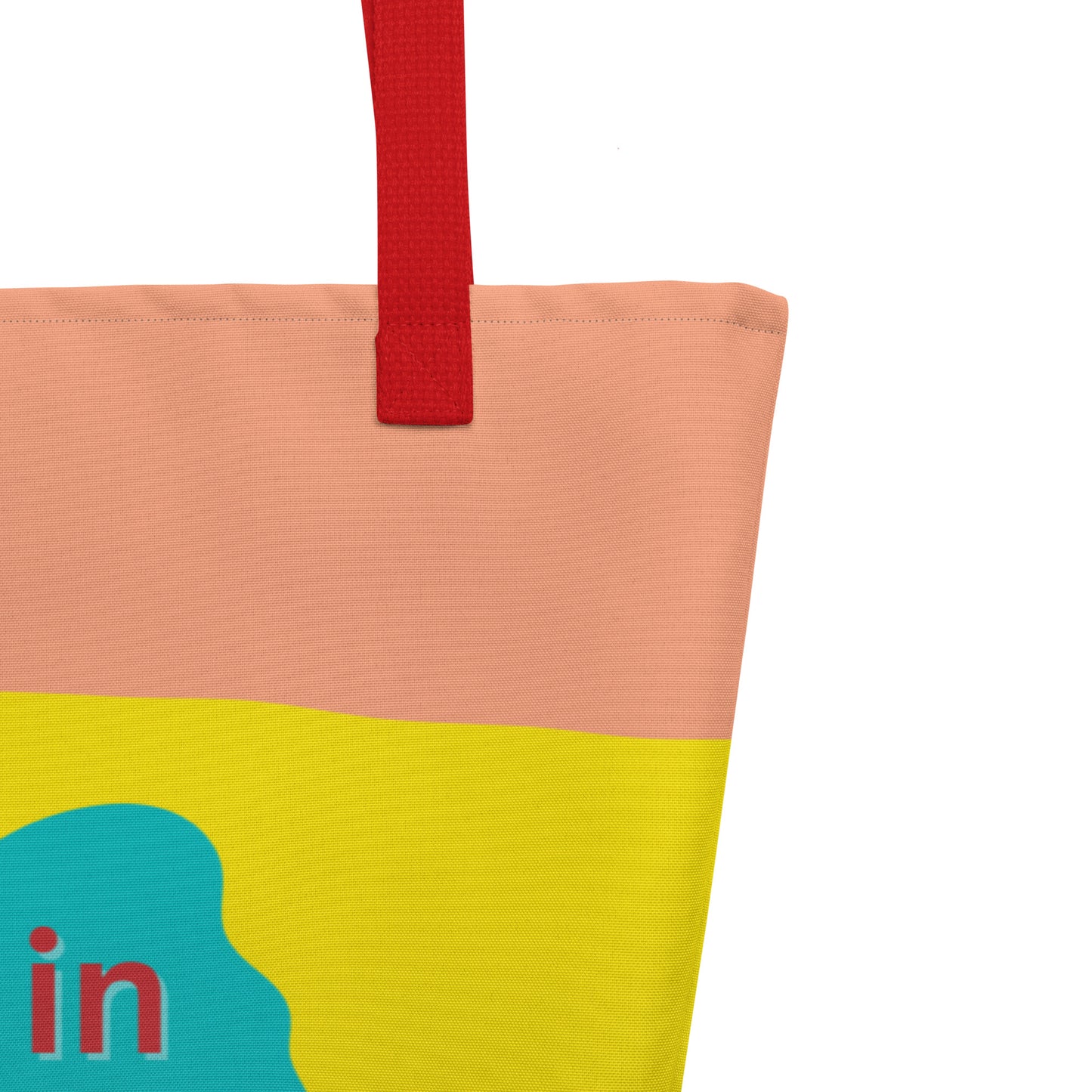 Close-up of the red woven handle, stitching along the top edge, and the peach/yellow/light color bands behind the teal flower graphic and red “resting in HIS promises” text.