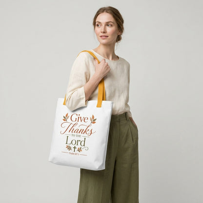 Model carrying a Christian Thanksgiving tote bag with a faith-based “Give Thanks to the Lord” design and fall-inspired details.