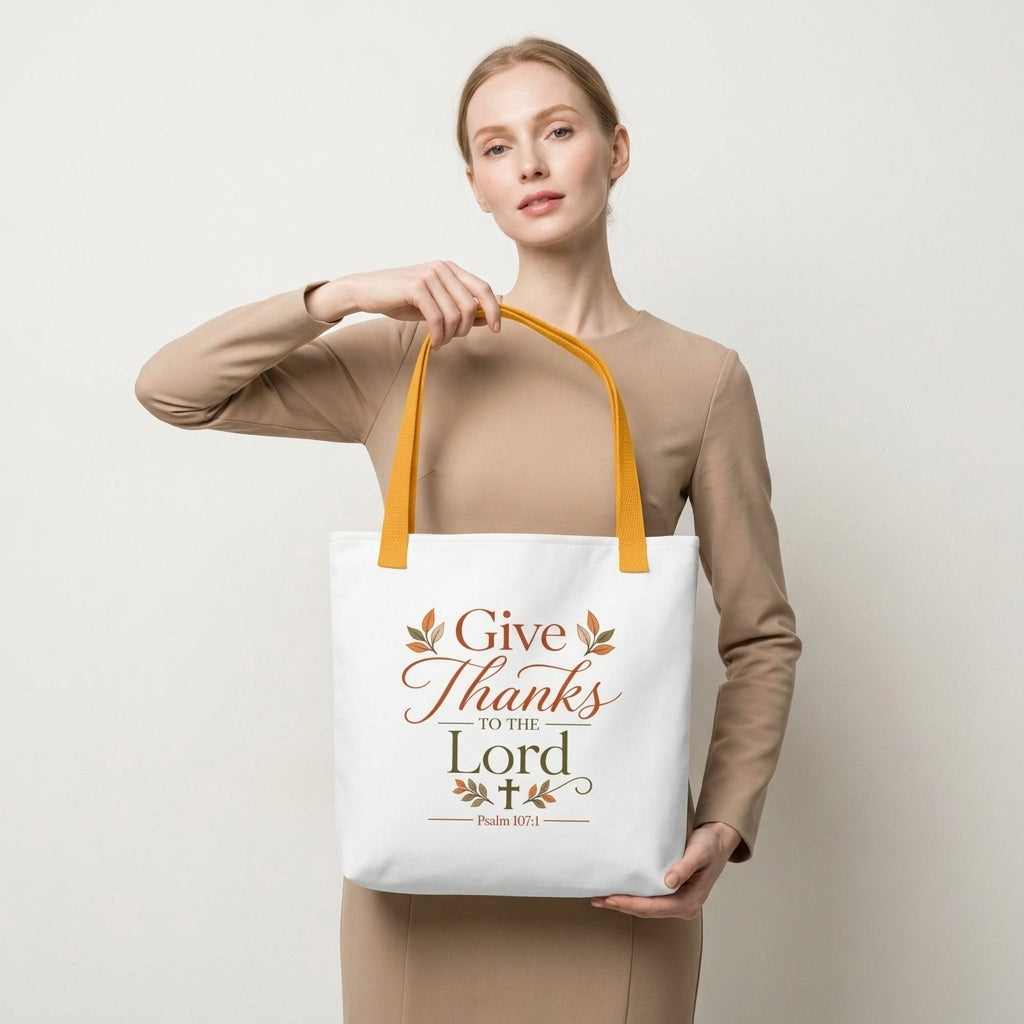 Model carrying a Christian Thanksgiving tote bag with a faith-based “Give Thanks to the Lord” design and fall-inspired details.