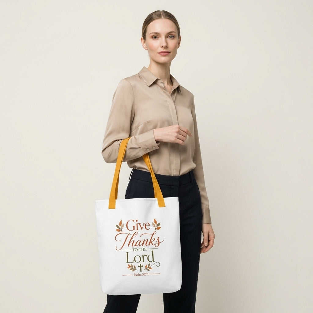 Model carrying a Christian Thanksgiving tote bag with a faith-based “Give Thanks to the Lord” design and fall-inspired details.
