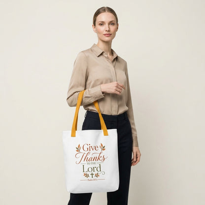 Model carrying a Christian Thanksgiving tote bag with a faith-based “Give Thanks to the Lord” design and fall-inspired details.